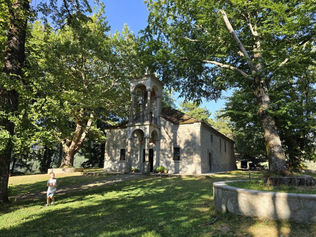 A small stone church among the trees